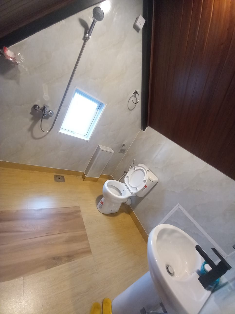 Bathroom with shower and window